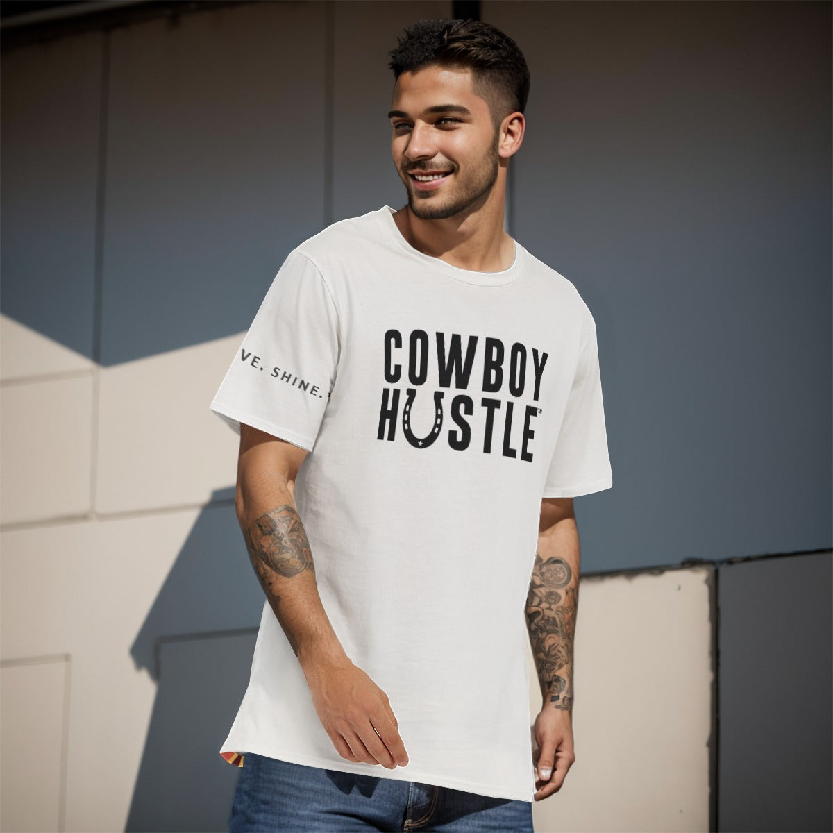 Model wearing the Cowboy Horseshoe HUSTLE All-Over Print Men's O-Neck T-Shirt in a lifestyle setting, showcasing the rugged, western-inspired design.